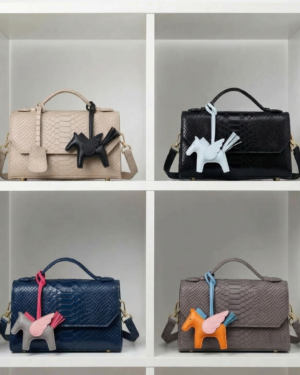 Bolsa by Ghafa All color on a shelf with angel charms